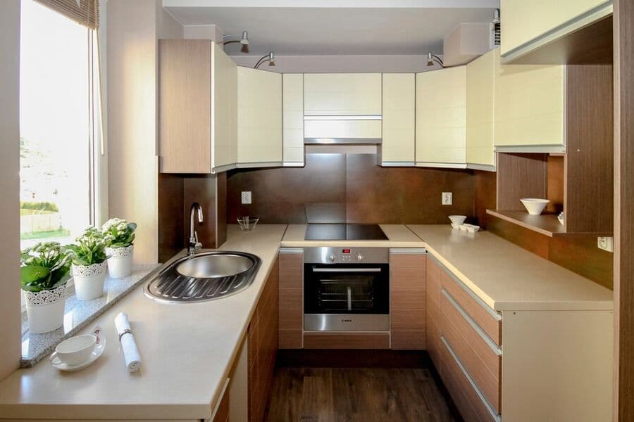 Compact fitted kitchen with oven, hob, sink and storage suitable for an annexe